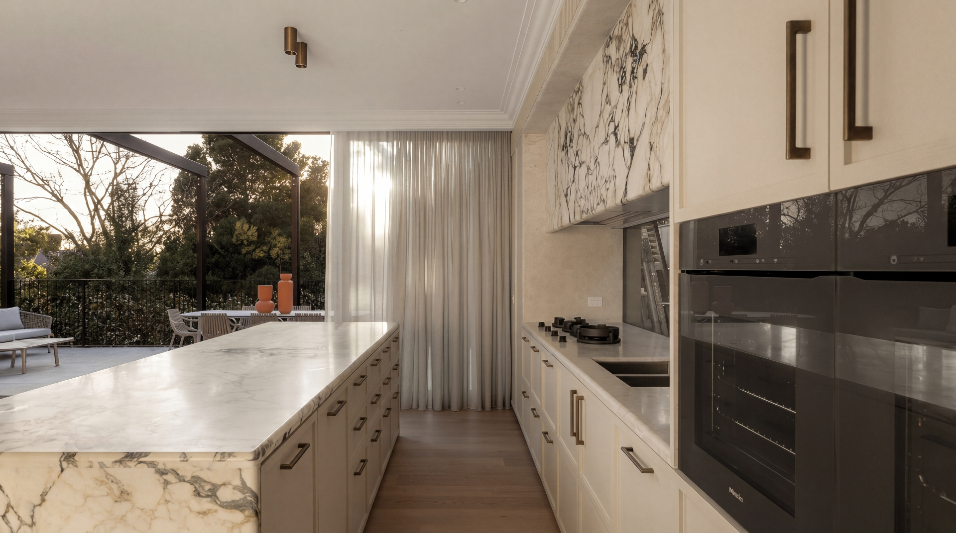 Calacatta Luxe Island Kitchen — cabinet carcases, doors removed